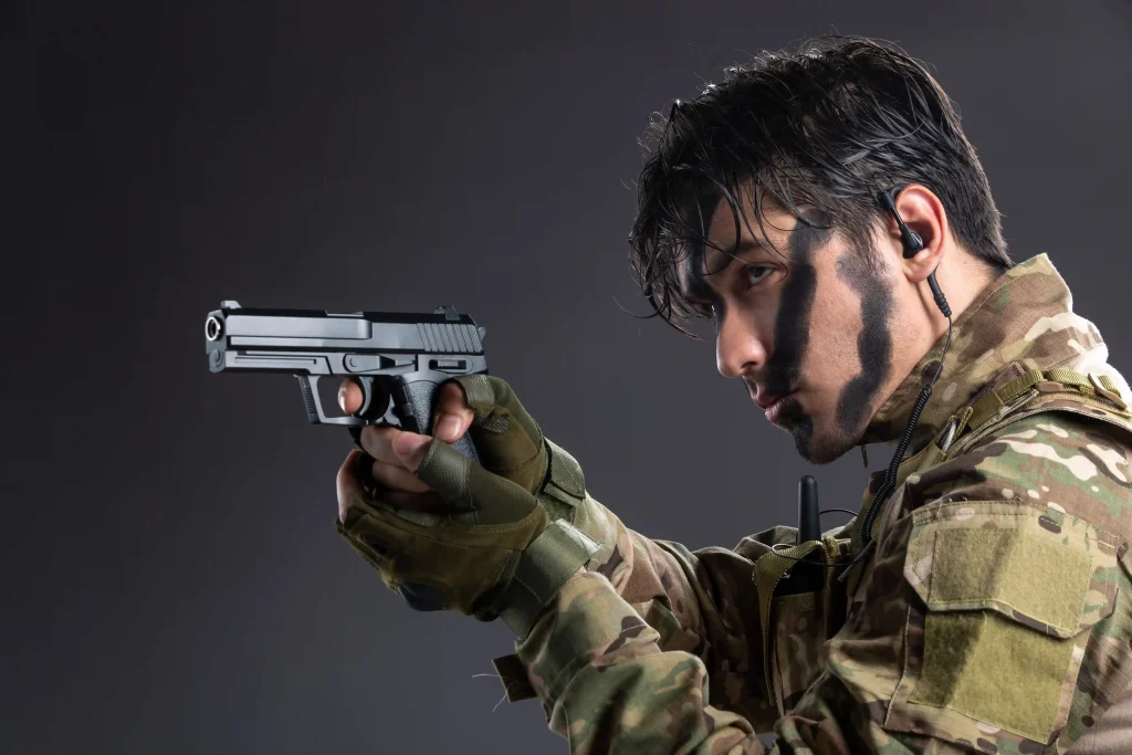 portrait-young-soldier-camouflage-aiming-gun-dark-wall